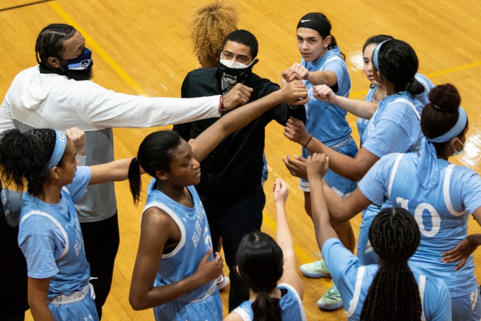 Immaculate Conception's basketball players show team spirit in a 2021 game against Pompton Lakes.