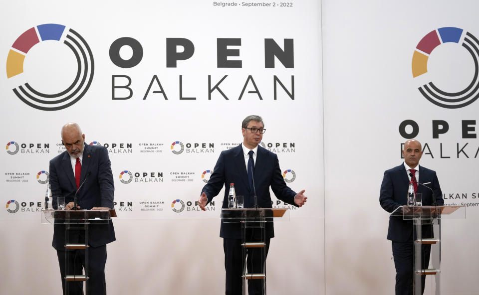 Albanian Prime Minister Edi Rama, left, and Macedonia's Prime Minister Dimitar Kovacevski, right, listen Serbian President Aleksandar Vucic during a press conference after the "Open Balkan" economic forum for regional cooperation in Belgrade, Serbia, Friday, Sept. 2, 2022. (AP Photo/Darko Vojinovic)