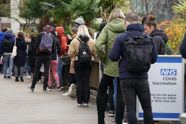 People queuing for booster jabs at St Thomas&#39; Hospital, London. Everyone over 18 in England will be offered booster jabs from this week, Prime Minister Boris Johnson said on Sunday night, as he declared an 