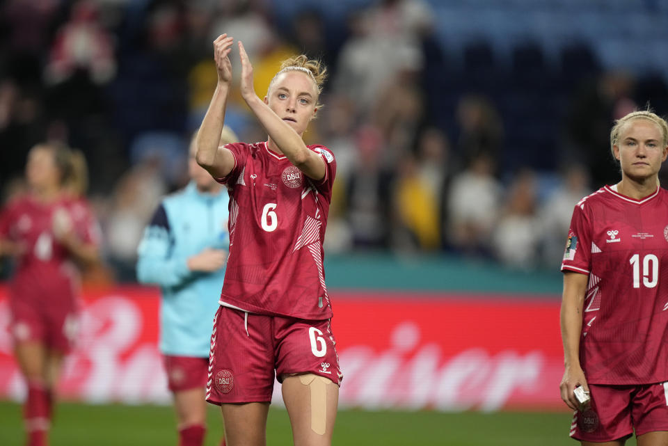 Denmark's Karen Holmgaard and Denmark's Pernille Harder, right, react after the Women's World Cup Group D soccer match between England and Denmark at the Sydney Football Stadium in Sydney, Australia, Friday, July 28, 2023. England won the match 1-0. (AP Photo/Rick Rycroft)