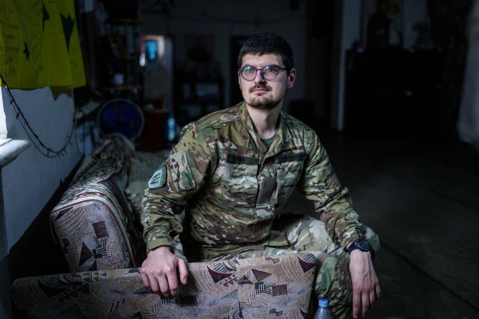 Oleksiy, callsign Feb, the commander of Avstriika evacuation bus team of the Hospitallers medical battalion, poses for a portrait at the battalion's base in Dnipro region after a 9-hour trip. (Serhii Korovayny/The Kyiv Independent)