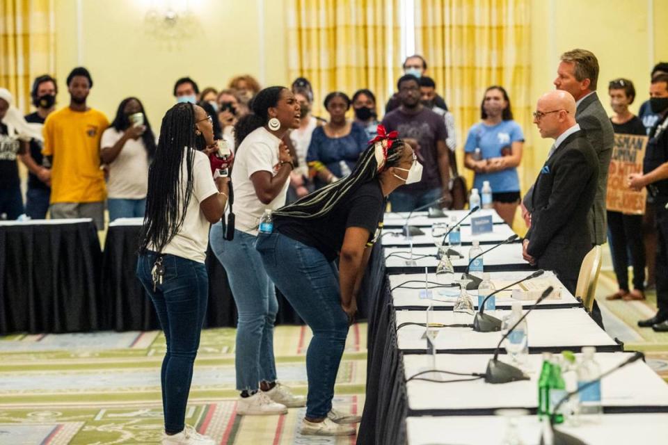 Demonstrators confront Gene Davis, vice chairman of the UNC-Chapel Hill Board of Trustees, and Chancellor Kevin Guskiewicz after the board voted to approve tenure for distinguished journalist Nikole Hannah-Jones Wednesday, June 30, 2021 at Carolina Inn in chapel Hill.