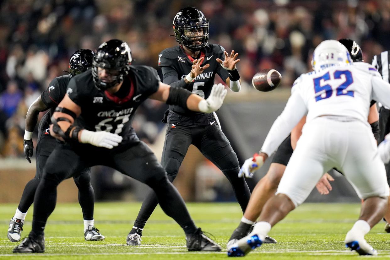 Cincinnati Bearcats quarterback Emory Jones (5) receives a snap during the NCAA college football game between the Cincinnati Bearcats and Kansas Jayhawks on Saturday, Nov. 25, 2023, at Nippert Stadium in Cincinnati. Kansas won 49-16.