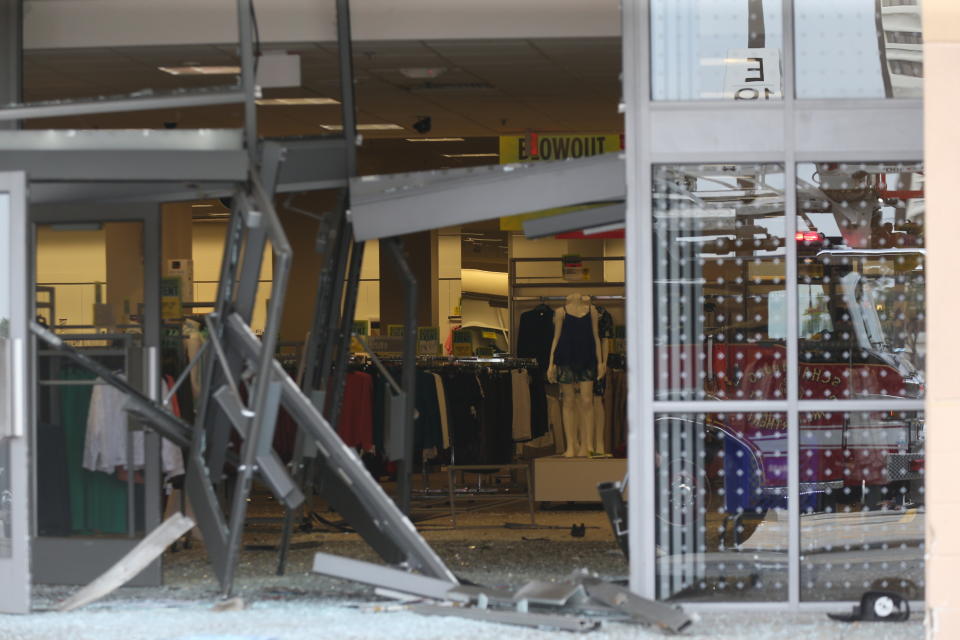 The damaged storefront of the Sears store at Woodfield Mall is seen after a man drove an SUV into the store in the Chicago suburb of Schaumburg, Ill., on Friday, Sept. 20, 2019. (John J. Kim/Chicago Tribune via AP)