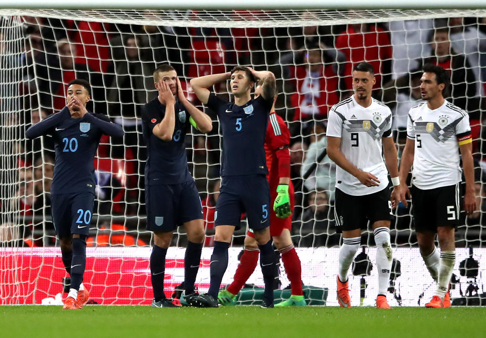 England’s Jesse Lingard (left), Eric Dier and John Stones (centre) react after a missed chance