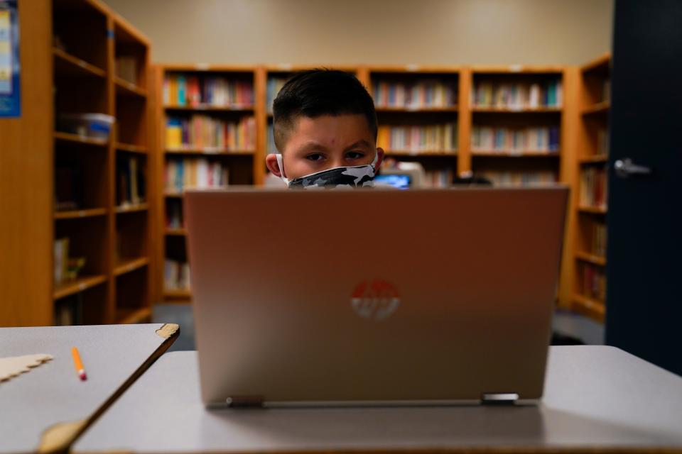 A Los Angeles Unified School District student attends an online class at the Boys & Girls Club of Hollywood on Wednesday, Aug. 26, 2020. The facility is open for children whose parents must leave home to work. There is no charge. Snacks and lunch are provided.