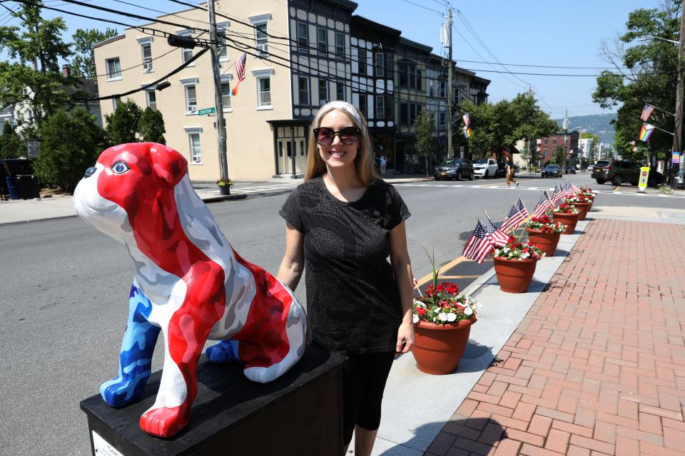 Artist Kristina Schmidt, head of the Bulldog Gallery Committee, with "Camo Hero," part of last year's Bulldog Gallery public-art display in downtown Irvington. The Bulldog Walking Gallery returns this weekend, part of the Irvington Summer Festival from noon to 4 p.m., June 2. The sculptures will be auctioned in the fall.