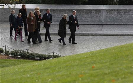 Members of the Kennedy family walk over to Robert and Edward Kennedy's gravesite to pay their respects at Arlington National Cemetery to mark the 50th anniversary of the assassination of former U.S. President John F. Kennedy at his gravesite in Arlington, November 22, 2013. REUTERS/Larry Downing