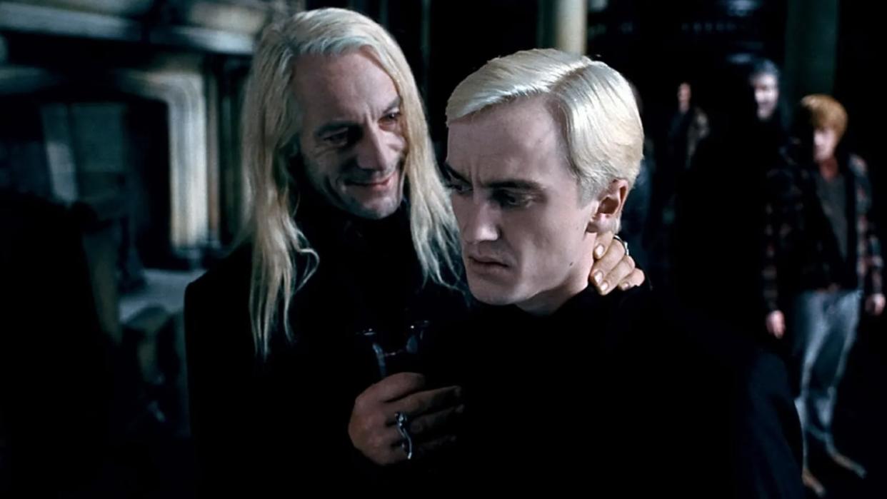  Jason Isaacs and Tom Felton in Harry Potter and the Deathly Hallows Part 1. 