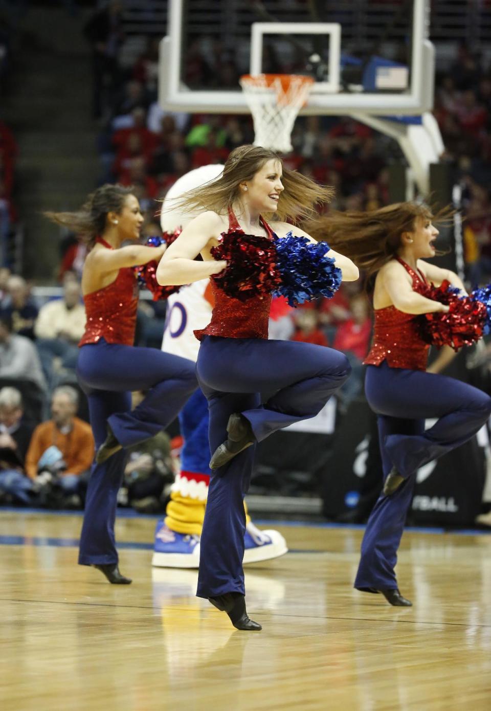 American cheerleaders perform during the first half of a second-round game in the NCAA college basketball tournament Thursday, March 20, 2014, in Milwaukee. (AP Photo/Jeffrey Phelps)