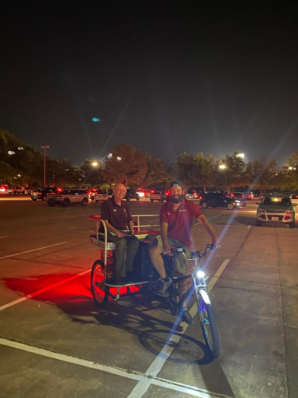 Art Hains riding on a rickshaw following Missouri State football's loss at Arkansas on Sept. 17, 2022, in Fayetteville, Arkansas. Hains began to feel sick the following day which led him to his first doctor appointments before being diagnosed with West Nile virus later in the week.