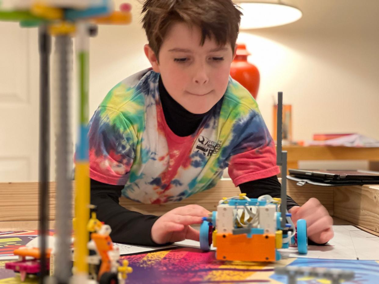 Ten-year-old J.J. Garcia of Williston concentrates as he modifies his team's robot during training on Feb. 2, 2024. For the second year in a row, the Green Mountain Homeschool Robotics team won their area and the state competition. The team was invited to represent Vermont at the world championship, which will take place in Houston, Texas, in April.