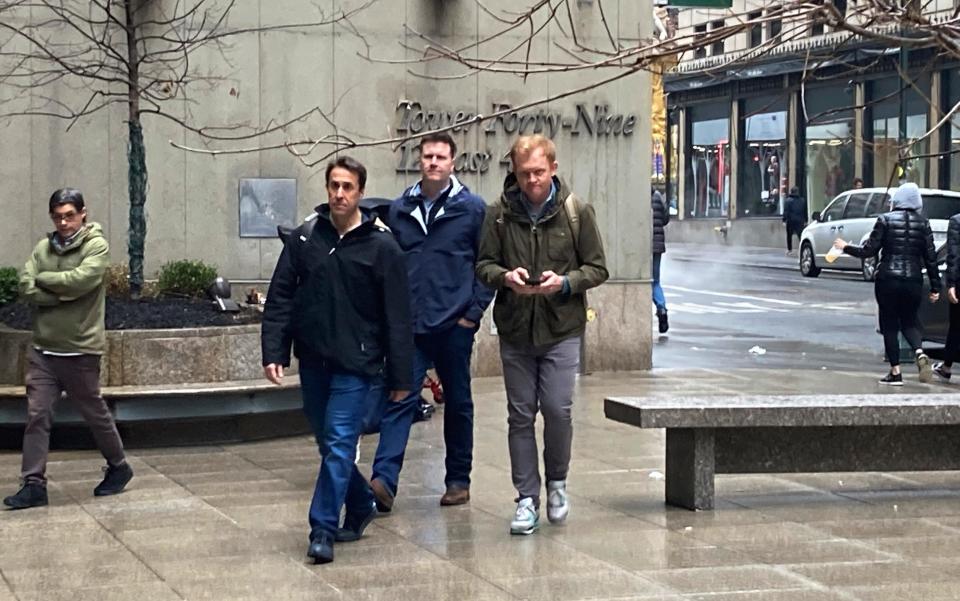 Major League Baseball deputy commissioner Dan Halem, left, senior vice president Patrick Houlihan, center, and executive vice president Morgan Sword, right, arrive at the office of the players' association in New York for labor negotiations.