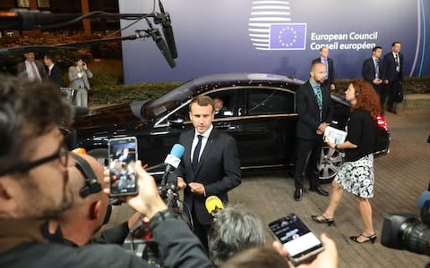 French president Emmanuel Macron speaks to the press before leaving the first day of the European Council  - Credit: LUDOVIC MARIN/AFP/Getty Images