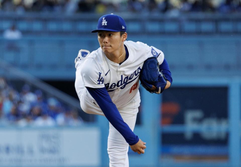 Dodgers pitcher Yoshinobu Yamamoto delivers in the first inning Saturday.