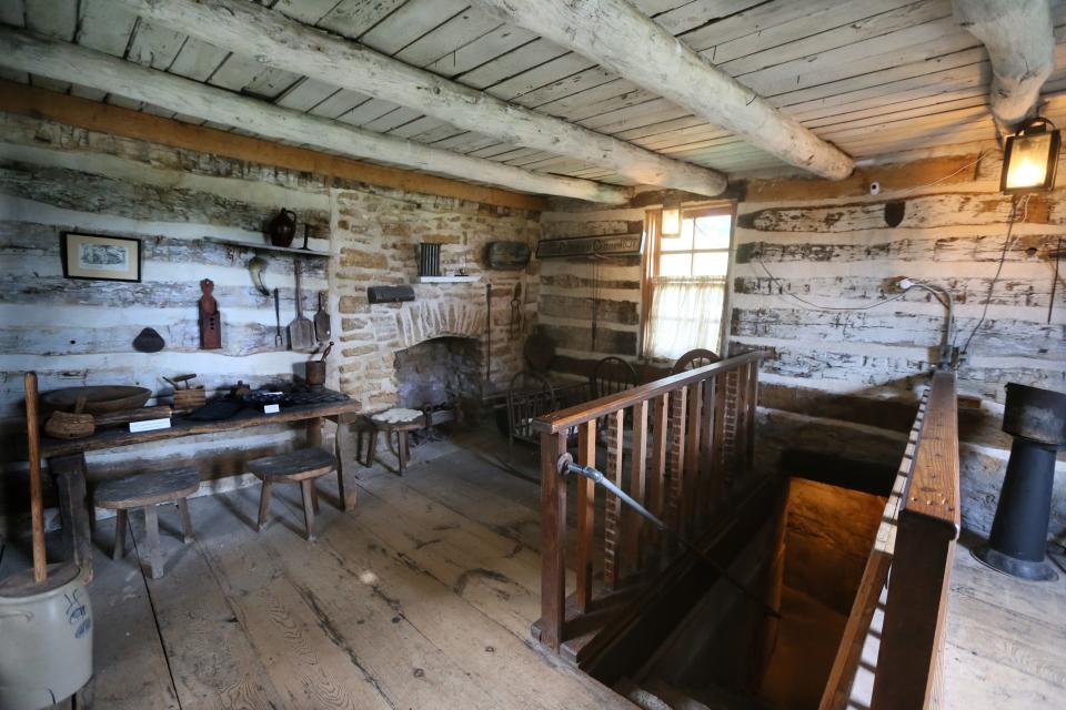 This log cabin at the Milton House Museum was built in 1837 and moved to Milton in 1839. It shows a staircase on the right, leading to a tunnel that slaves used to escape to freedom. When and how the tunnel was originally built is unknown.