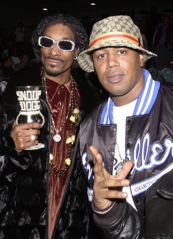 <p>Theo Wargo/WireImage</p> Snoop Dogg and Master P attend Super Bowl XXXVI - Jam Sports All Star Celebrity Basketball Game