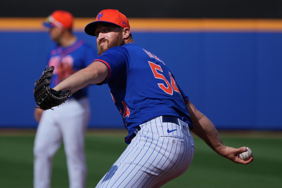 New York Mets pitcher Austin Adams (54) warms-up in the seventh inning against the New York Yankees at Clover Park on March 5, 2023, in Port St. Lucie, Fla.