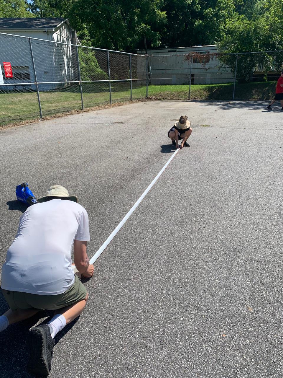 Volunteers with the Woodfin Parks and Greenways Advisory Committee and the community helped to convert a  portion of the parking lot at Woodfin’s Geneva Maney Park into pickleball courts following the launch of a Pickleball pilot program. August 2022.