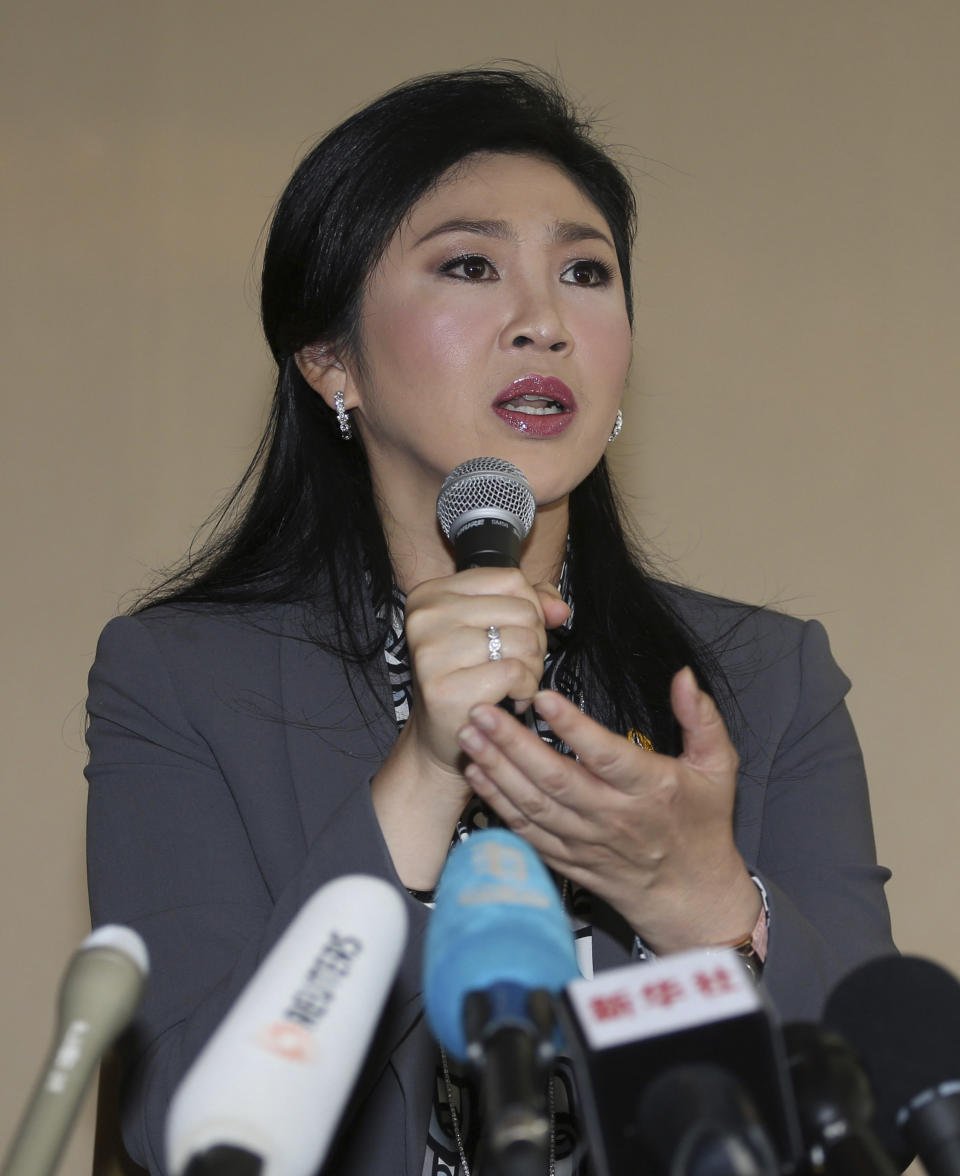 In this Jan. 17, 2014 photo, Thai Prime Minister Yingluck Shinawatra answers questions during an interview with the foreign media at the office of Permanent Secretary for Defense on the outskirts of Bangkok, Thailand. From inside her “war room” in a temporary office at the Defense Ministry, Yingluck is watching television feeds of flag-waving protesters trying to bring down her government. The demonstrators have taken over key pockets of downtown Bangkok, blocking off their territory with sandbag walls guarded by supporters. They refuse to negotiate, and they’re trampling campaign billboards bearing her image amid increasing doubt that the election she called next month can be held. Yingluck can’t order a police crackdown for fear of triggering a military coup. And she is now facing a serious legal threat: the country’s anti-corruption commission announced this week it will probe her handling of a controversial rice policy, an investigation that could force her from office if it is successful. (AP Photo/Apichart Weerawong)