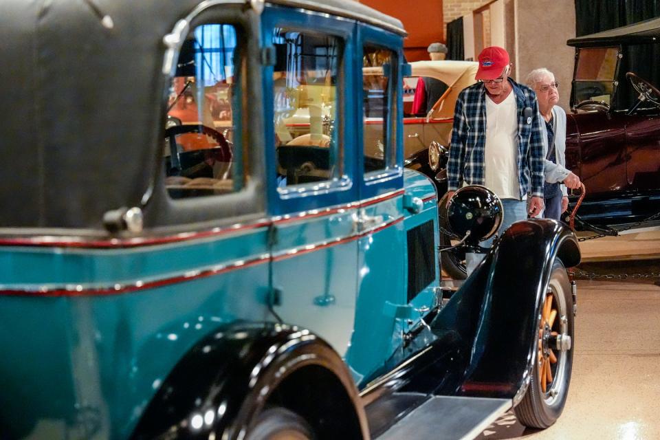 Tom and Anna Tupka, of West Haven, Conn. tour the new Pontiac Transportation Museum that features a collection of vintage Pontiac cars, military vehicles and other transportation artifacts from Pontiac's history, Thursday, July 18, 2024. The Tupkas are members of the Pontiac Oakland Club International and are in town for the 33rd Annual Ames Performance Pontiac Nationals in Norwalk, Ohio.