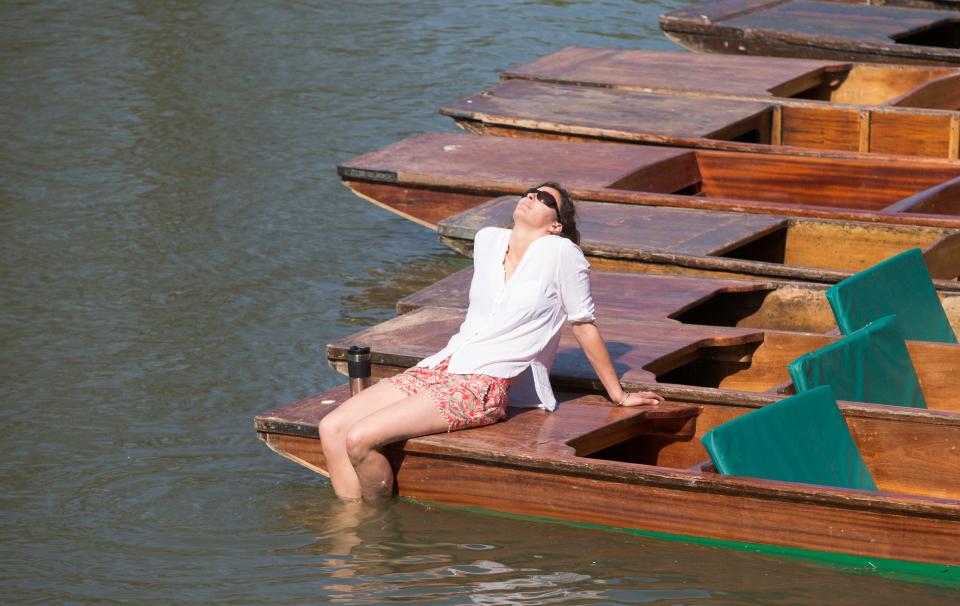 Someone takes advantage of the sun on the River Cam (Rex)