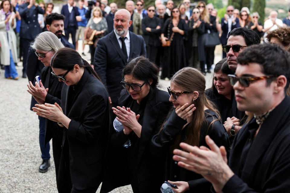 Family members of Italian designer Roberto Cavalli react during his funeral ceremony, at the Basilica di San Miniato al Monte, in Florence, Italy, April 15, 2024. REUTERS/Yara Nardi