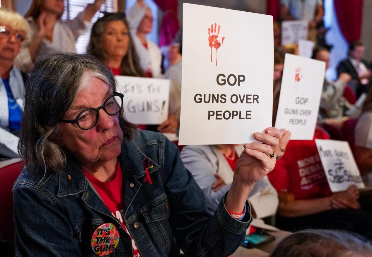 <span>Gun reform activists protest in the gallery at the Tennessee state capitol building in Nashville on 23 April 2024.</span><span>Photograph: Seth Herald/Reuters</span>