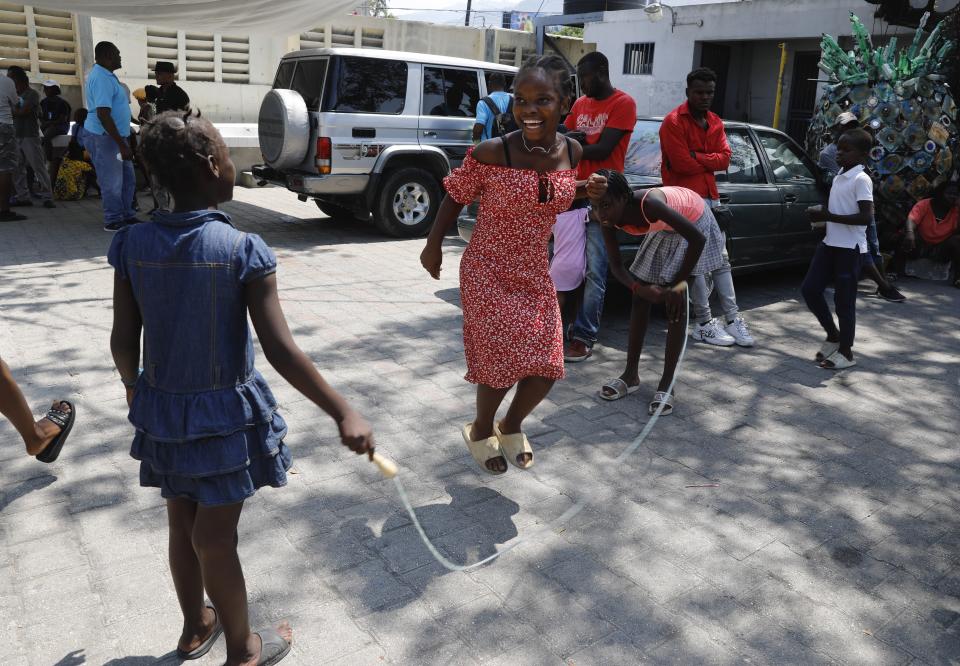 Children play at a shelter for families displaced by gang violence in Port-au-Prince, Haiti, Wednesday, March 13, 2024. (AP Photo/Odelyn Joseph)