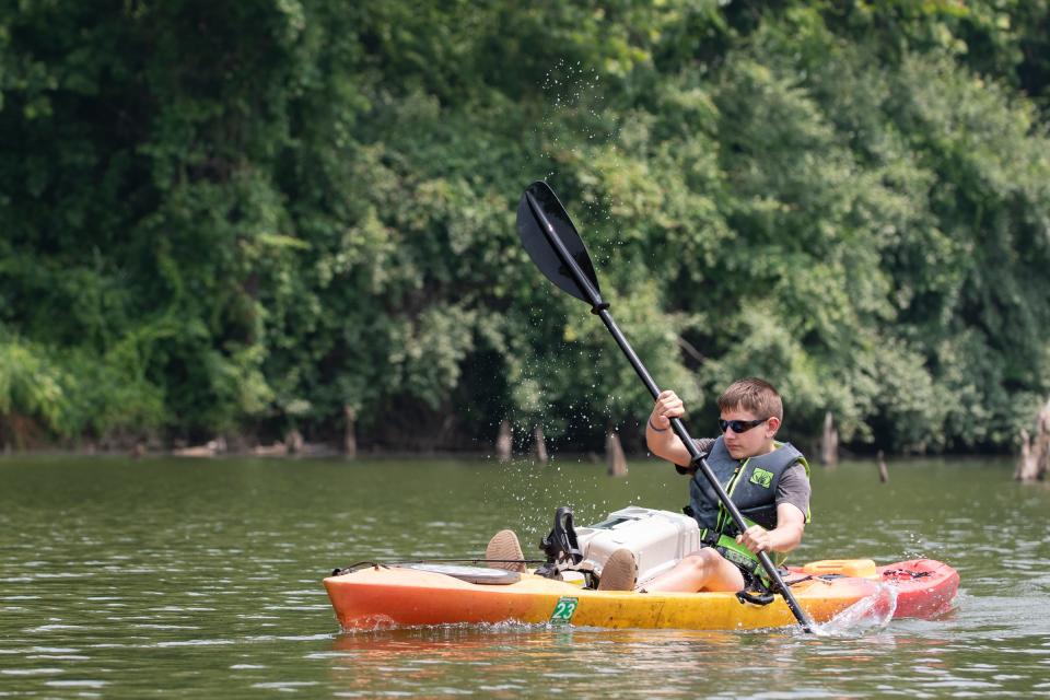 Mason Riexinger, 12, of Springtown, paddles his kayak across Giving Pond in Upper Black Eddy on Thursday, June 29, 2023.