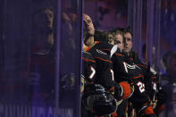 Anaheim Ducks center Ryan Getzlaf, center, listens to the national anthem before the start of an NHL hockey game against the St. Louis Blues Wednesday, March 3, 2021, in Anaheim, Calif. (AP Photo/Marcio Jose Sanchez)