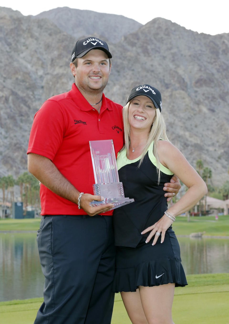 Patrick Reed, left, and wife Justine Reed pose with the trophy after the final round of the Humana Challenge PGA golf tournament on the Palmer Private course at PGA West, Sunday, Jan. 19, 2014, in La Quinta, Calif. (AP Photo/Matt York)