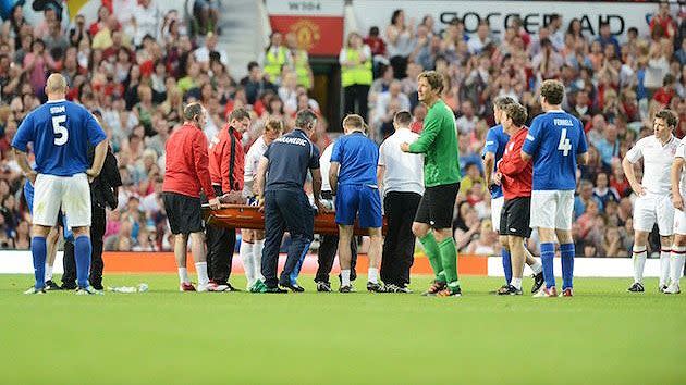 Gordon Ramsay gets stretchered off the Wembley pitch.