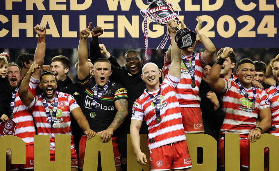 Wigan players, pictured here with the trophy after beating Penrith in the World Club Challenge earlier this year.