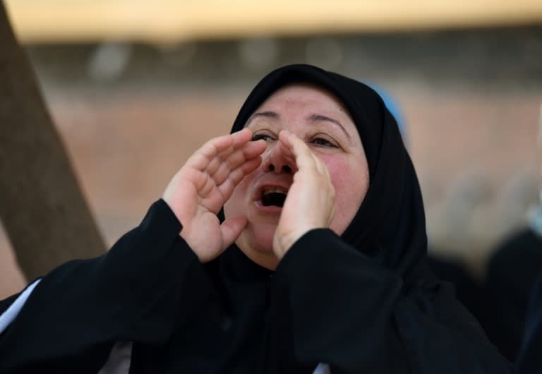 The mother of US-Egyptian charity worker Aya Hejazi celebrates outside the court after her daughter, who was accused of human trafficking and exploitation of children, was aquitted on April 16, 2017