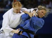 Ronda Rousey , right, from the United States battles with Annett Boehm of Germany during he women's judo -70kg middleweight division finals at the Beijing 2008 Olympics in Beijing, Wednesday, Aug. 13, 2008. USA won the bronze. (AP Photo/Charles Dharapak)