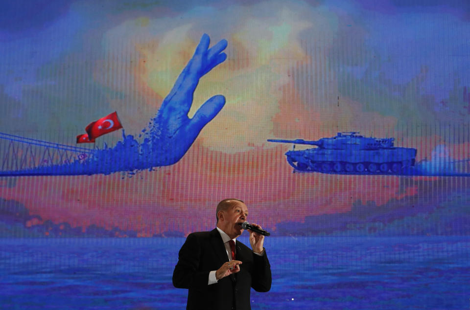 FILE - Turkey's President Recep Tayyip Erdogan gestures as he delivers a speech at a rally to honor the victims of the July 15, 2016, failed coup attempt, in Istanbul, on July 15, 2019. The 69-year-old who has served as prime minister since 2003 and president since 2014, started his career as a reformist who expanded rights and freedoms, allowing his majority-Muslim country to start European Union membership negotiations. (AP Photo/Lefteris Pitarakis, File)