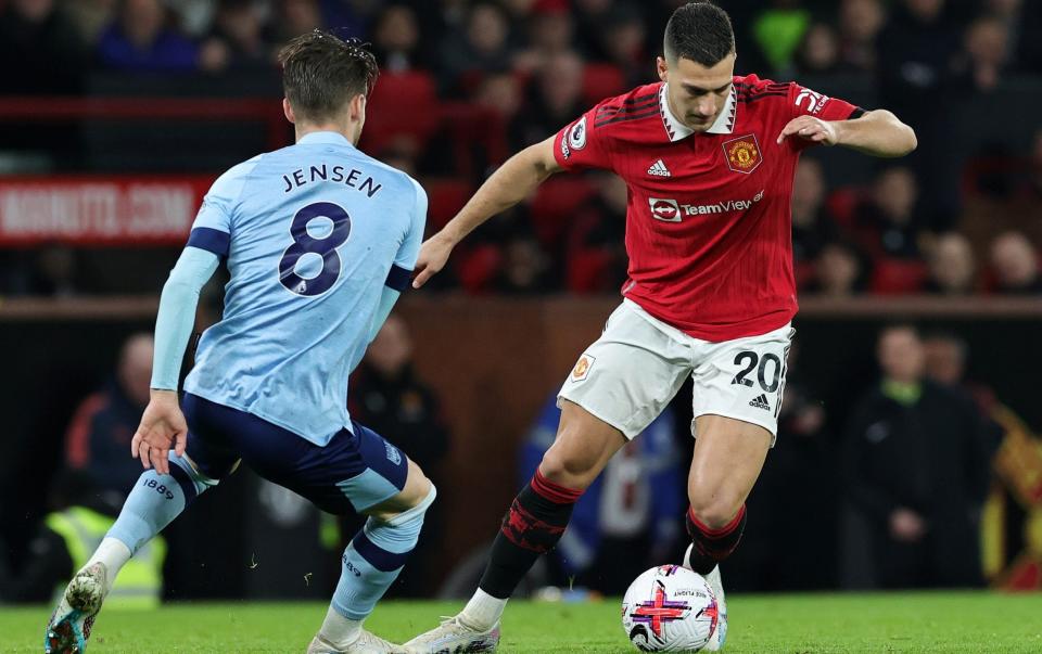 Diogo Dalot of Manchester United runs with the ball whilst under pressure from Mathias Jensen of Brentford during the Premier League match between Manchester United and Brentford FC at Old Trafford on April 05, 2023 in Manchester, Englan - David Rogers/Getty Images