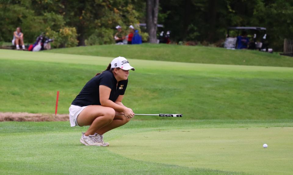 Colonel Crawford's Madison Gray reads the green on the 5th hole at Sycamore Springs in the Division II district golf tournament.