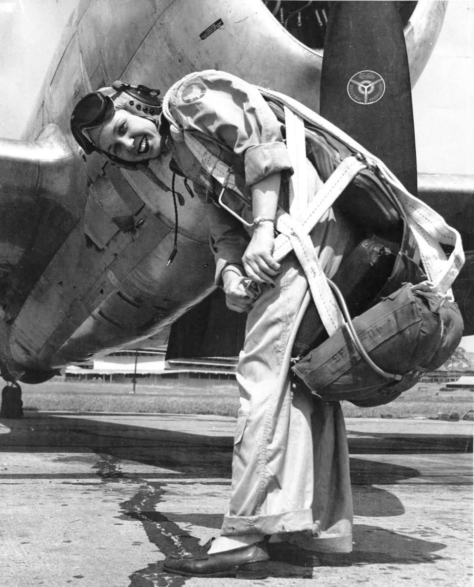 WASP pilot Deanie Parrish in front of P-47 Thunderbolt on the flight line at Tyndall Field, Florida, circa 1943.