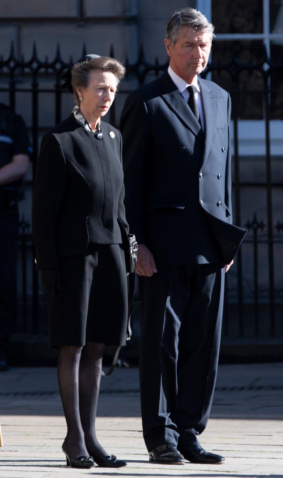 Princess Anne and husband Vice Adm. Sir Timothy  Laurence watch as the coffin of Queen Elizabeth II is taken to a hearse as it departs St Giles' Cathedral, in Edinburgh, Scotland Sept. 13, 2022, to be flown to London and taken to Buckingham Palace.