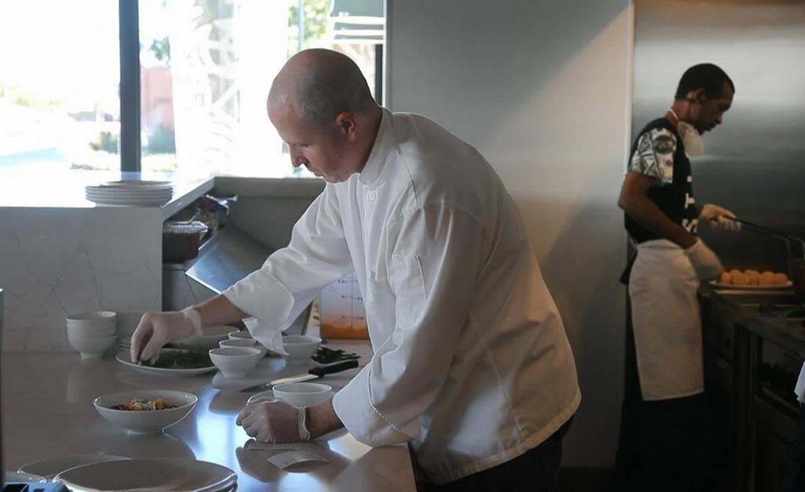 Chef Jeff Williams prepares a dish at the Taste Project Community Restaurant.