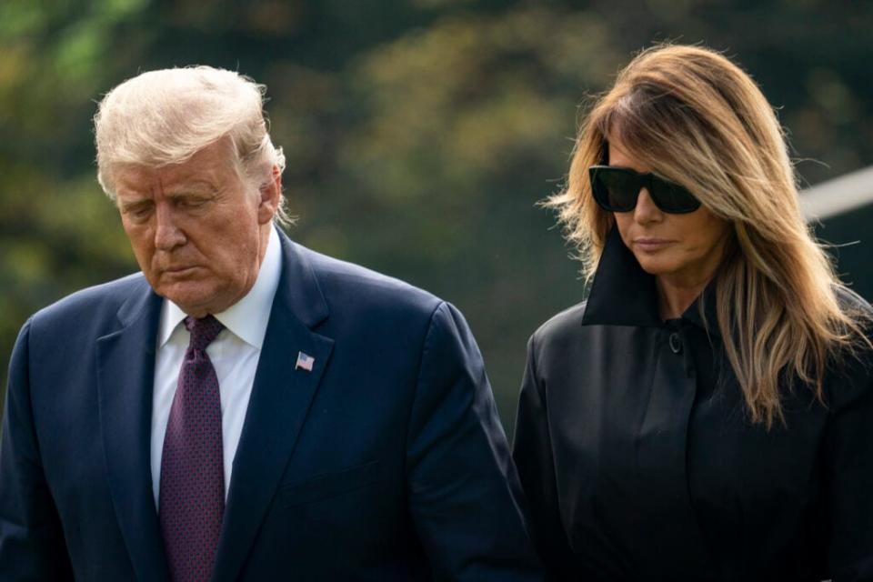 U.S. President Donald Trump and first lady Melania Trump walk to the White House residence as they exit Marine One on the South Lawn of the White House on September 11, 2020 in Washington, DC. (Photo by Drew Angerer/Getty Images)