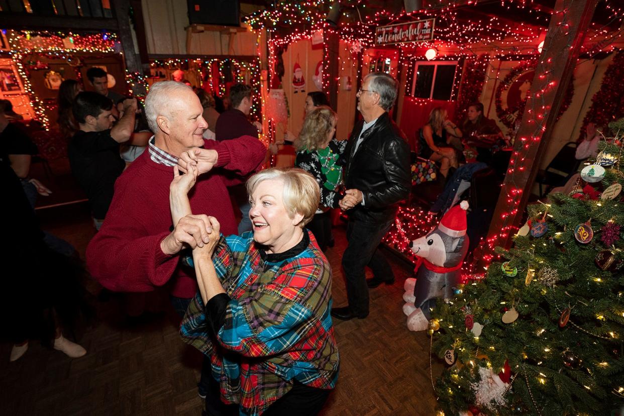 Johnna and Bill Appenbrink dance Dec. 13 to honky-tonk piano man Frank Cavitt at the festive, heavily decorated Donn's Depot.