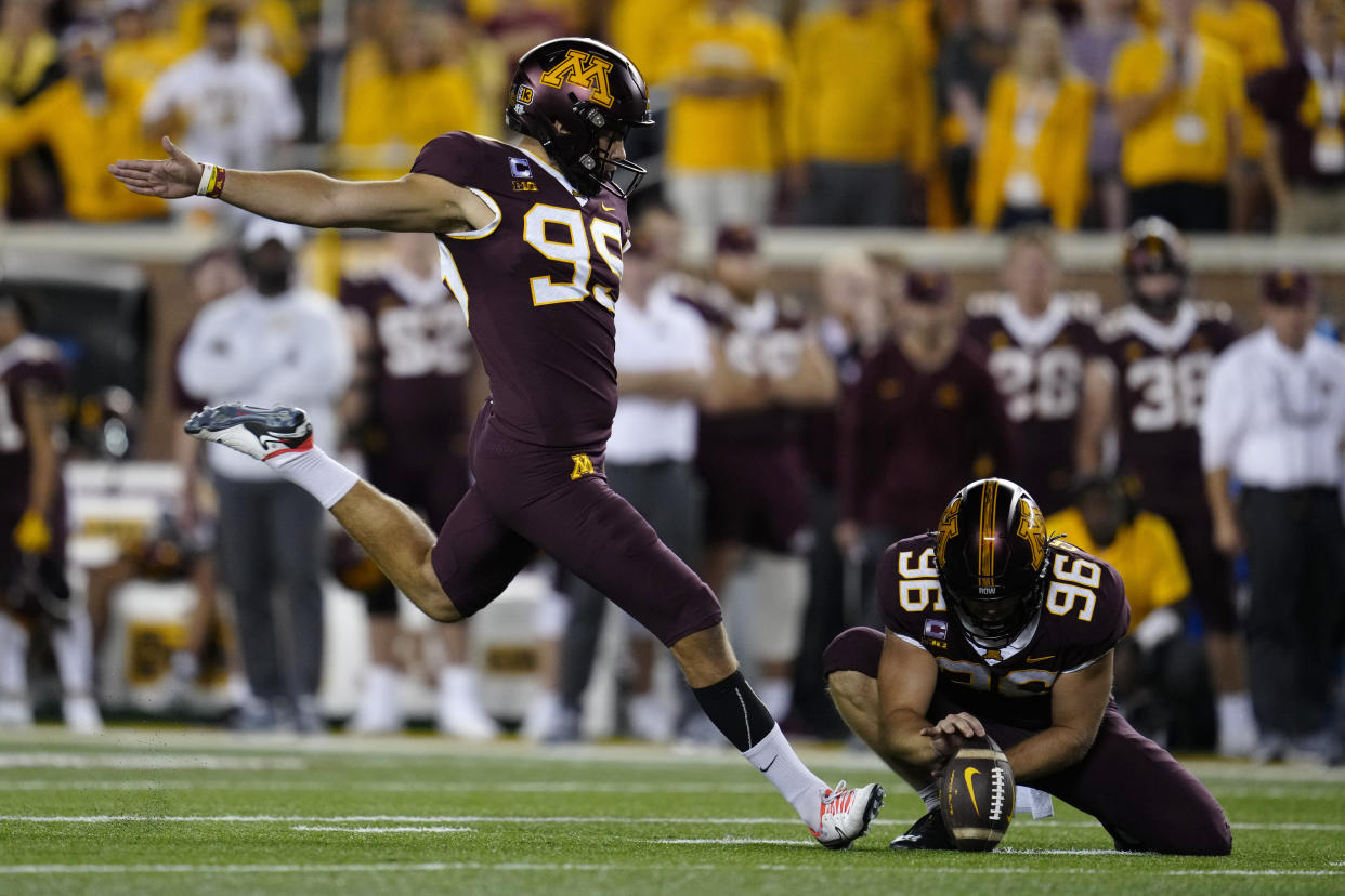 Minnesota place-kicker Dragan Kesich (99) kicks a field goal on the final play to give Minnesota a 13-10 win over Nebraska in an NCAA college football game Thursday, Aug. 31, 2023, in Minneapolis. (AP Photo/Abbie Parr)