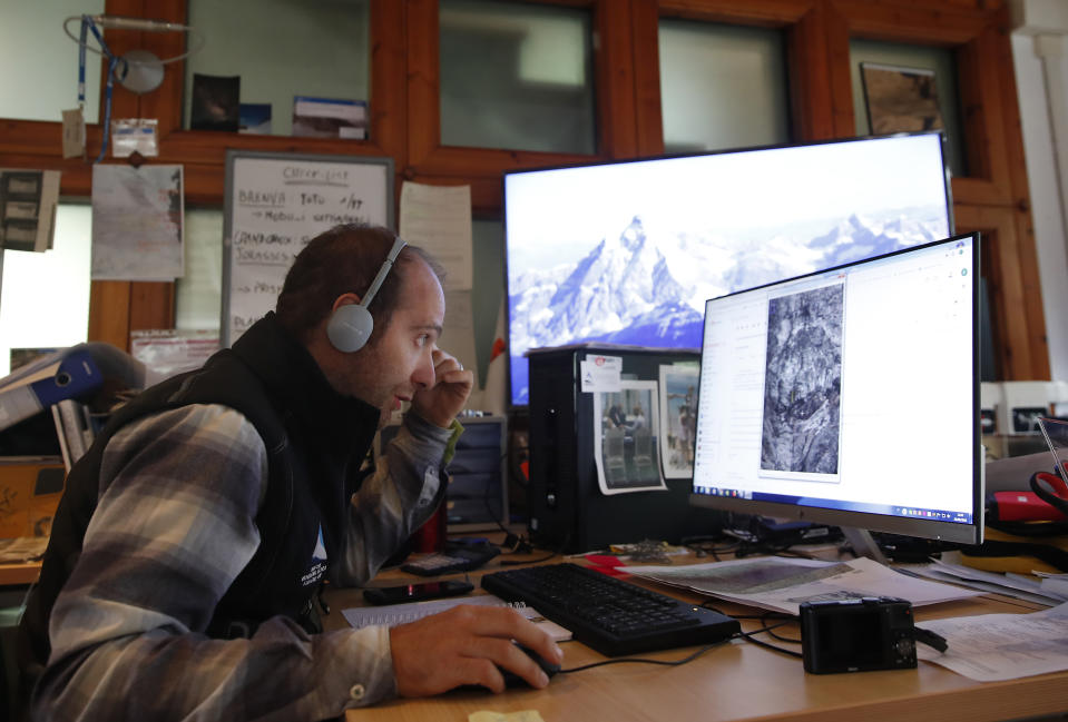 Glaciologist of Fondazione Montagna Sicura, Safe Mountain Foundation, Fabrizio Troilo, monitors computer images of the Planpincieux glacier, near Courmayeur, Italy, Thursday, Sept. 26, 2019. Italian officials sounded an alarm Wednesday over climate change due to the threat that the fast-moving melting glacier is posing to the picturesque valley near the Alpine town of Courmayeur. The glacier, which spreads 1,327 square kilometers (512 square miles) across the mountain, has been moving up to 50 centimeters (nearly 20 inches) a day (AP Photo/Antonio Calanni)