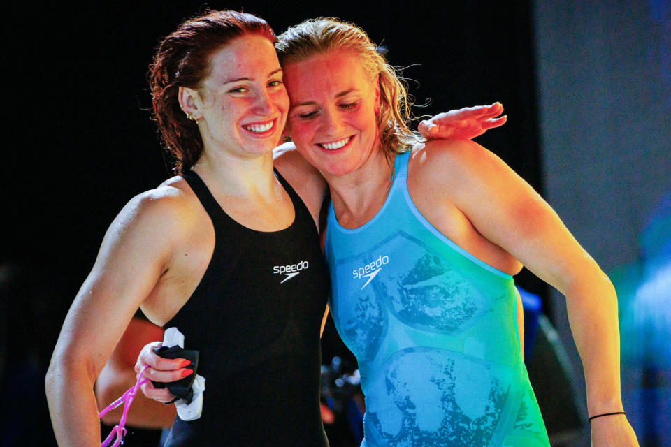 Australia's Ariarne Titmus (R) and compatriot Mollie O'Callaghan react after Titmus won the women's 200m freestyle final in a new world record time, while O'Callaghan also went under her previous world record to finish second, during the Australian Swimming Trials at the Brisbane Aquatic Centre on June 12, 2024. (Photo by Patrick HAMILTON / AFP) / -- IMAGE RESTRICTED TO EDITORIAL USE - STRICTLY NO COMMERCIAL USE -- (Photo by PATRICK HAMILTON/AFP /AFP via Getty Images)