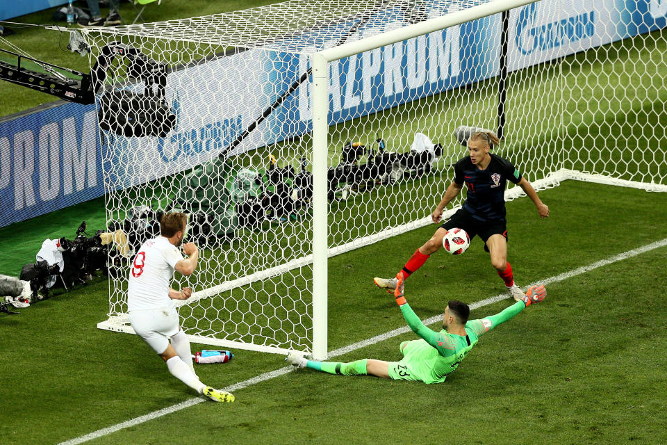 <p>Danijel Subasic of Croatia throws himself at a shot from Harry Kane of England during the 2018 FIFA World Cup Russia Semi Final match between England and Croatia at Luzhniki Stadium on July 11, 2018 in Moscow, Russia. (Photo by Joosep Martinson – FIFA/FIFA via Getty Images) </p>