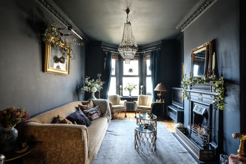 black living room features Victorian decor