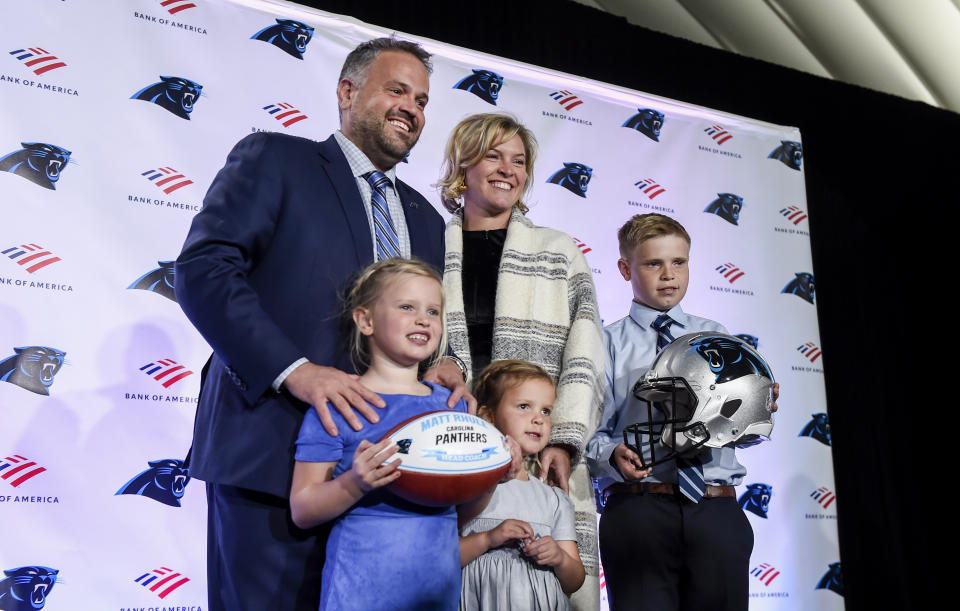 Carolina Panthers NFL football team new head coach Matt Rhule poses with his wife, Julie, and children from left, Vivi, Leanna and Bryant after a news conference at the teams practice facility, Wednesday, Jan. 8, 2020 in Charlotte, N.C. (AP Photo/Mike McCarn)